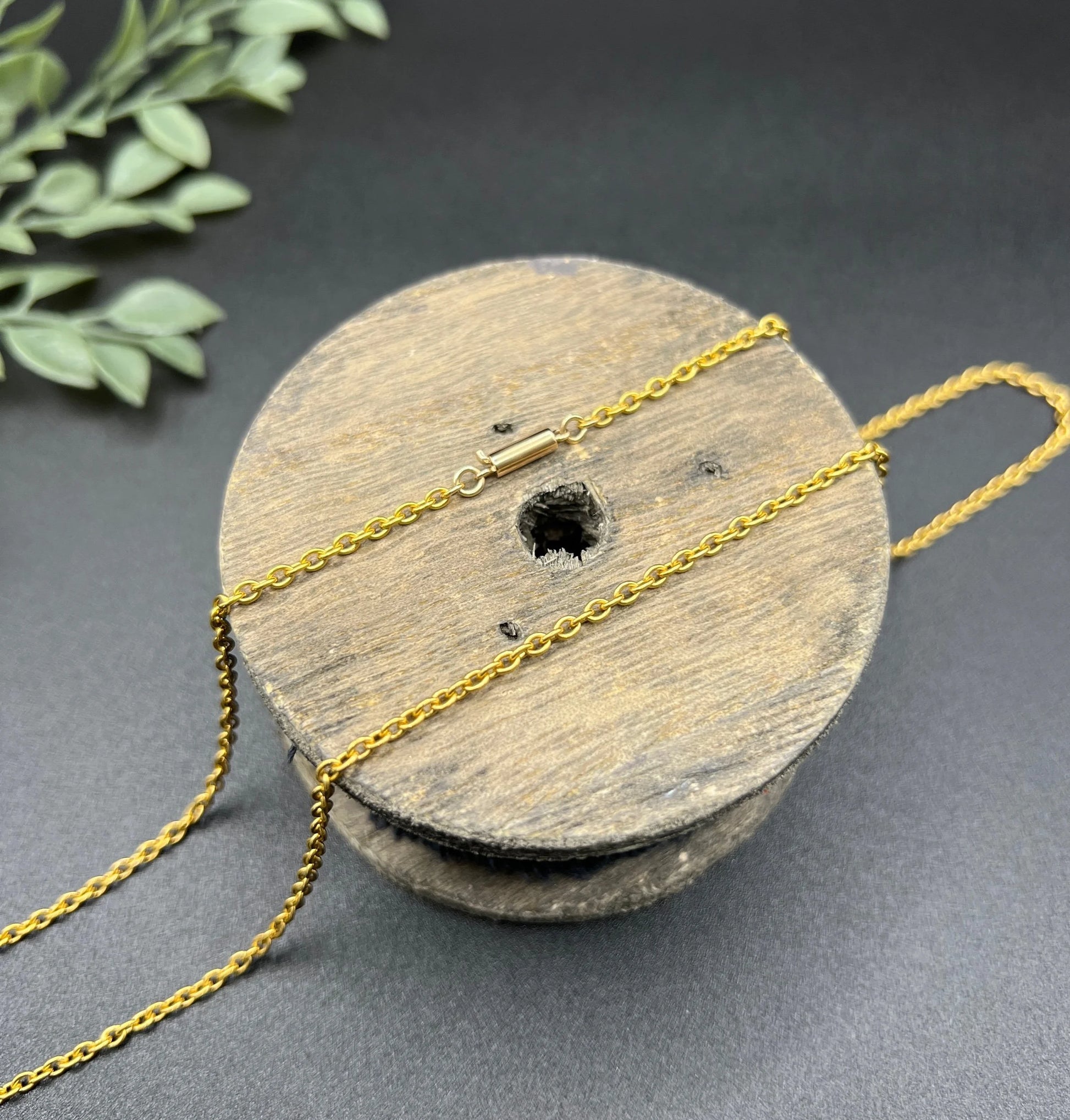 A yellow gold trace link chain necklace