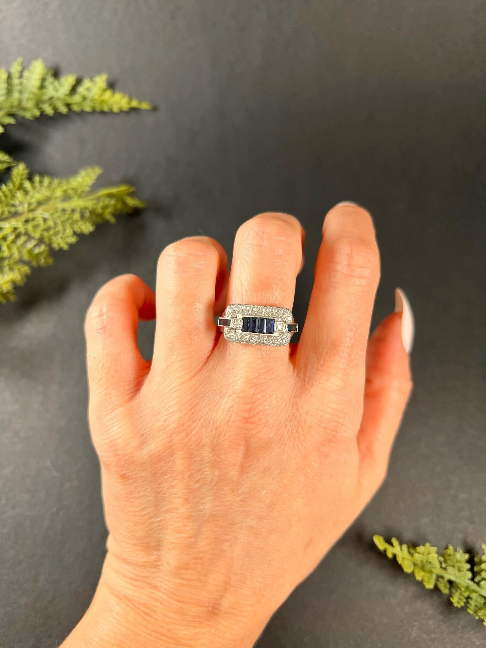 A sapphire and diamond cocktail ring in platinum, modelled on a hand