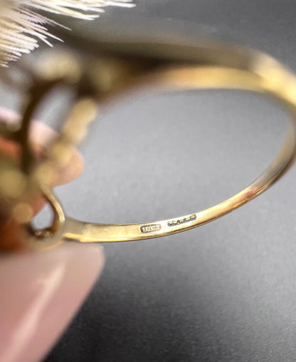 Close-up of 18CT stamp inside a yellow gold ring shank