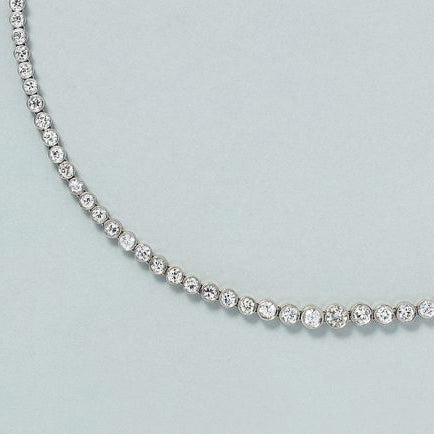 9ct Diamond Line Tennis Necklace in Platinum, 9 carats of round brilliant-cut diamonds set in individual bezel settings which gradually increase in size to the middle