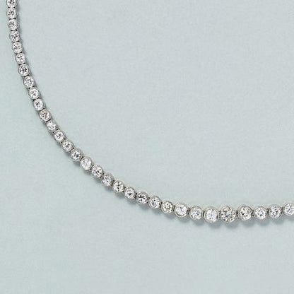 9ct Diamond Line Tennis Necklace in Platinum, 9 carats of round brilliant-cut diamonds set in individual bezel settings which gradually increase in size to the middle