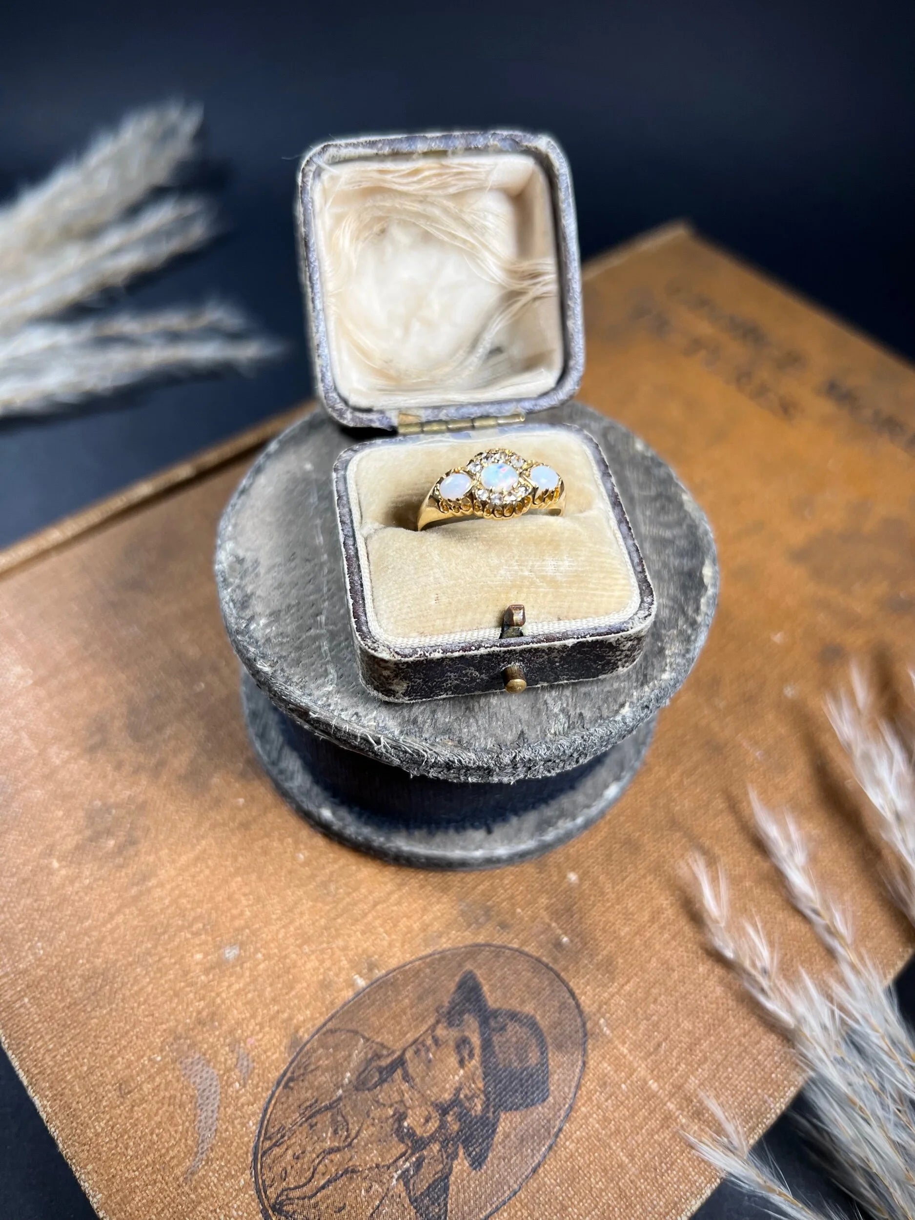 A yellow gold opal and diamond dress ring, in a ring box
