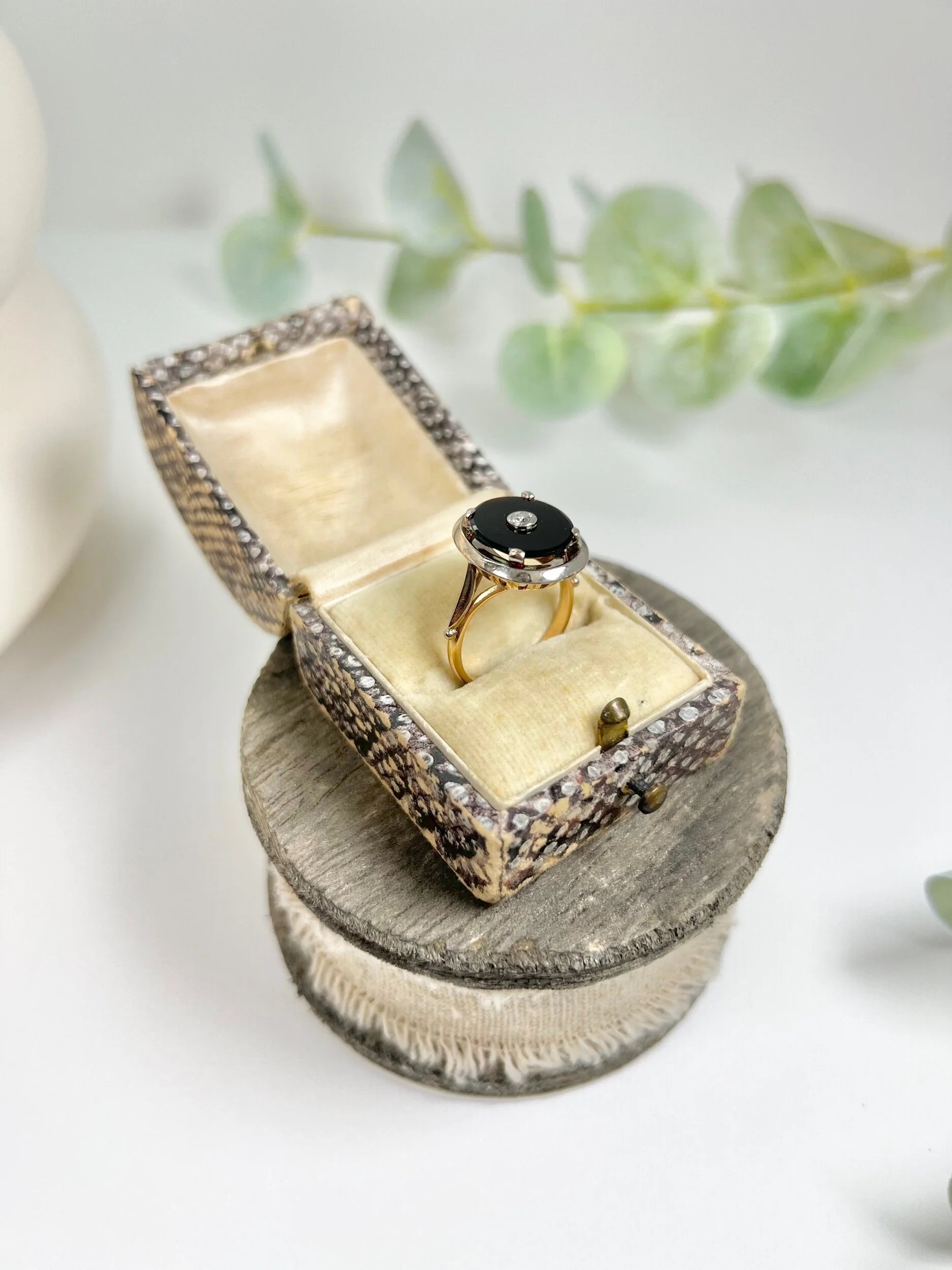 Art Deco 18 Carat Two Colour Gold Oval Onyx and Diamond Halo Ring, Circa 1920