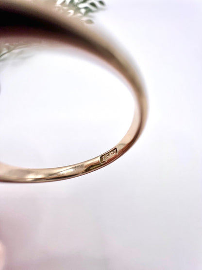 Close-up of a 15CT stamp inside a gold ring shank
