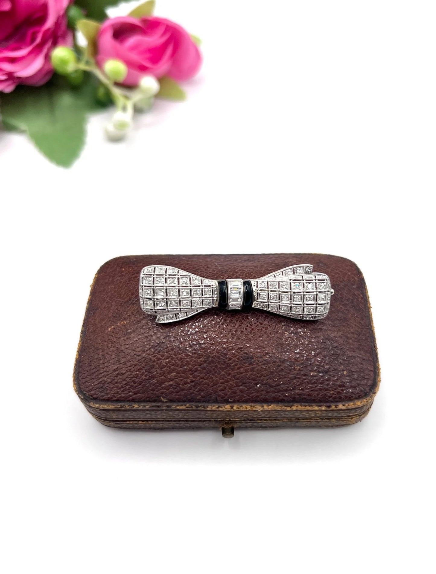 Art Deco 14 Carat White Gold Onyx and Diamond Bow Brooch, Circa 1920