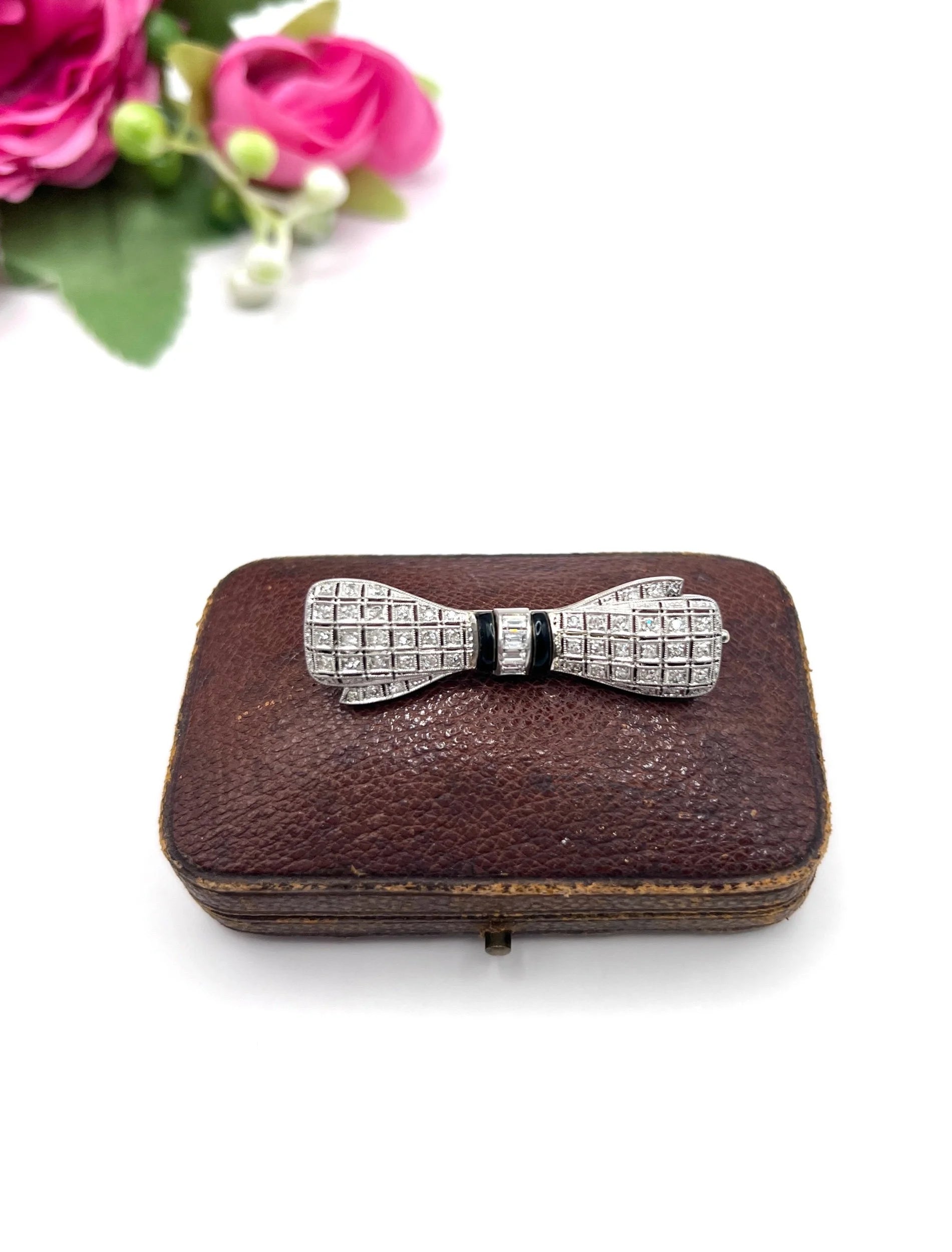 Art Deco 14 Carat White Gold Onyx and Diamond Bow Brooch, Circa 1920