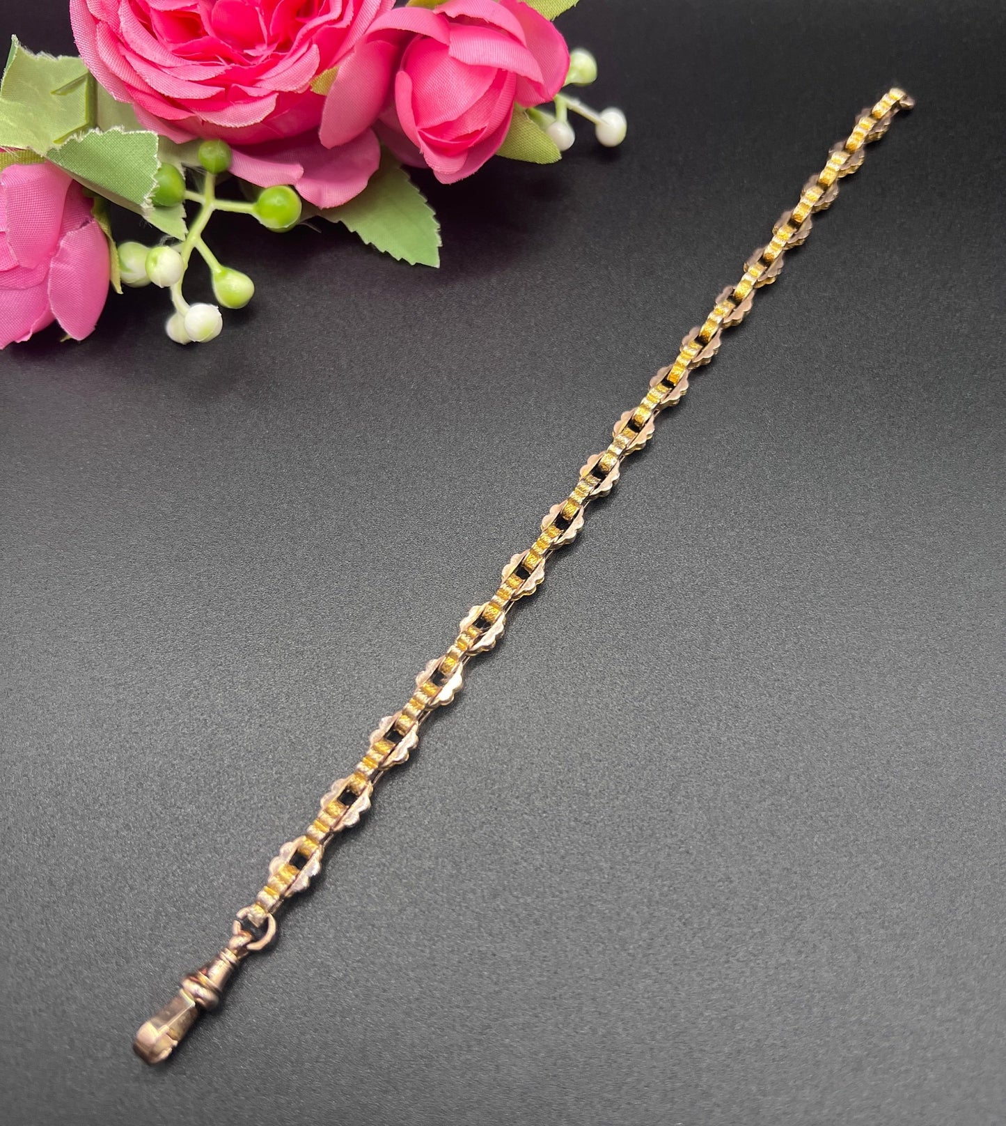 A fancy link yellow gold bracelet with a lobster claw clasp