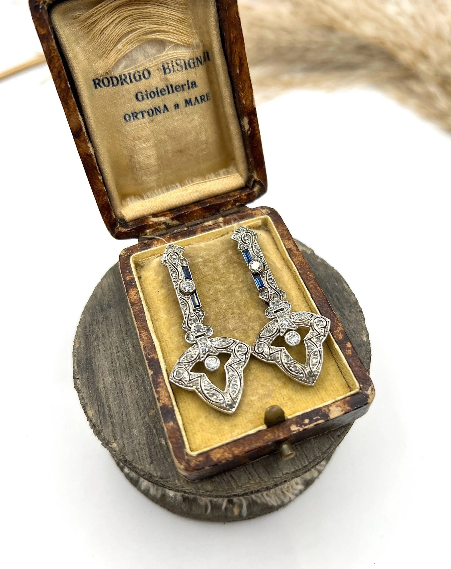 A pair of diamond and sapphire drop earrings, in an antique box