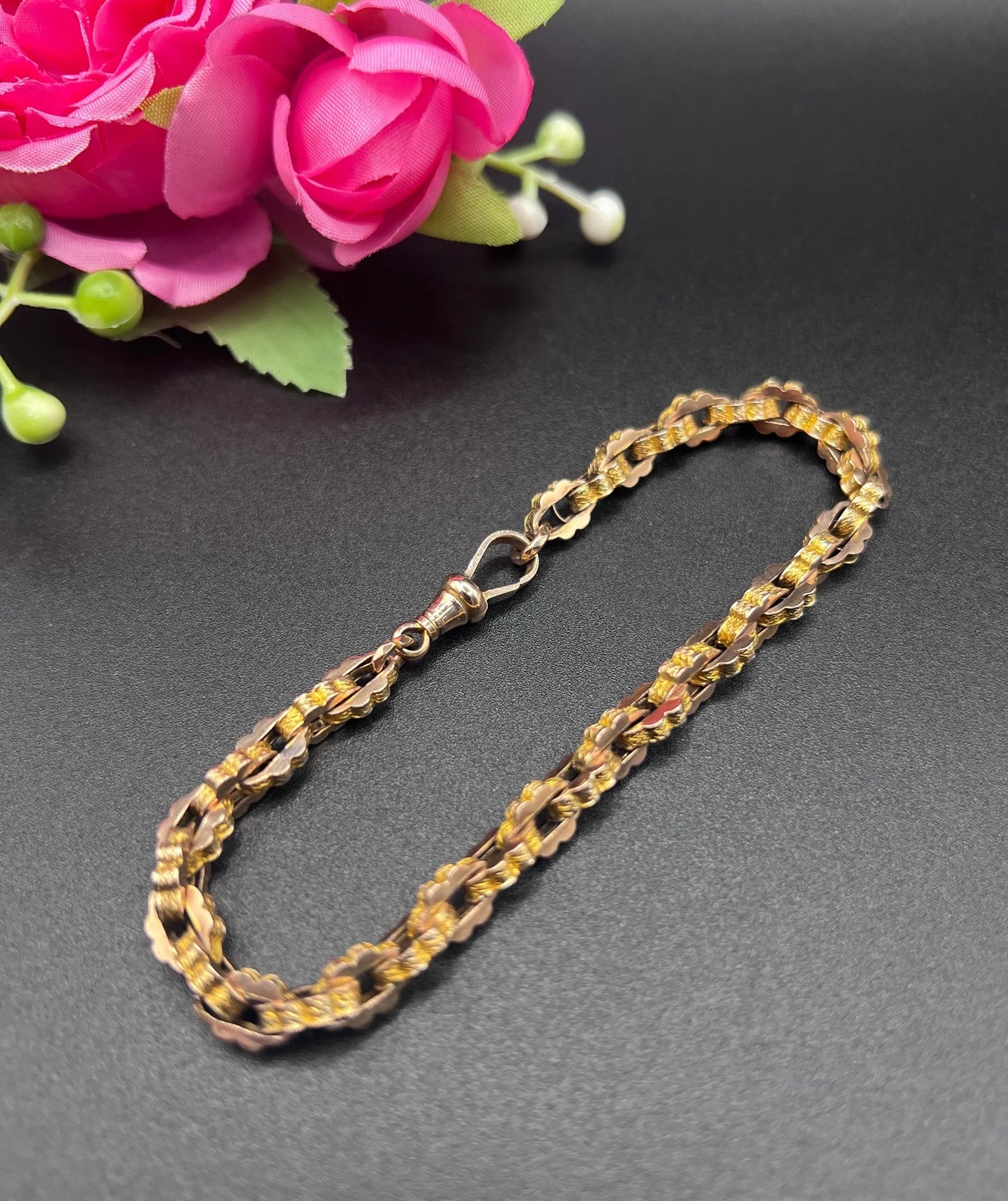A fancy link yellow gold bracelet with a lobster claw clasp