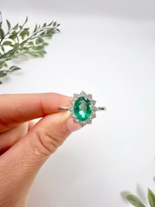 Emerald And Diamond Cluster Ring In 18 Carat White Gold