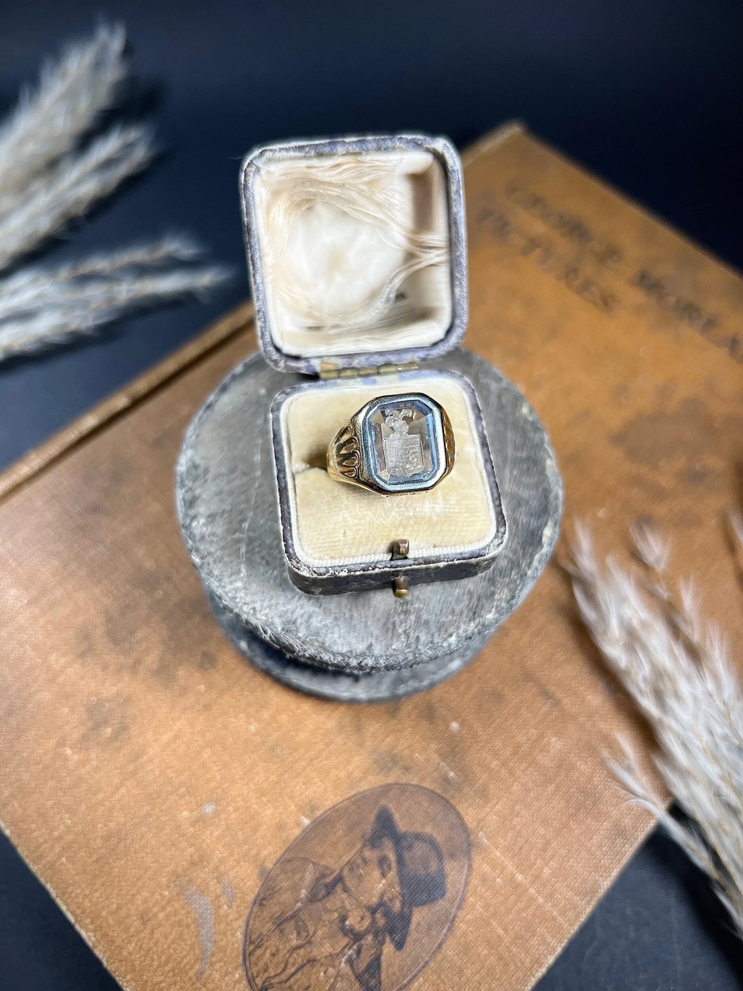A yellow gold blue glass intaglio signet ring, in a ring box