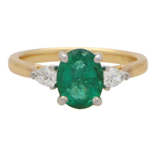 Emerald and Pear Cut Diamond Three Stone Engagement Ring