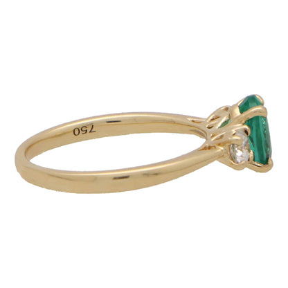 Oval Emerald and Diamond Three Stone Engagement Ring