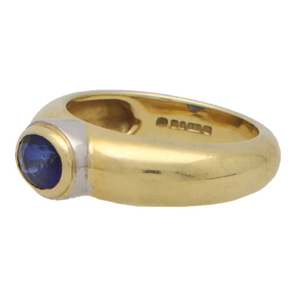 Garrard & Co. blue sapphire gypsy ring set in yellow and white gold.