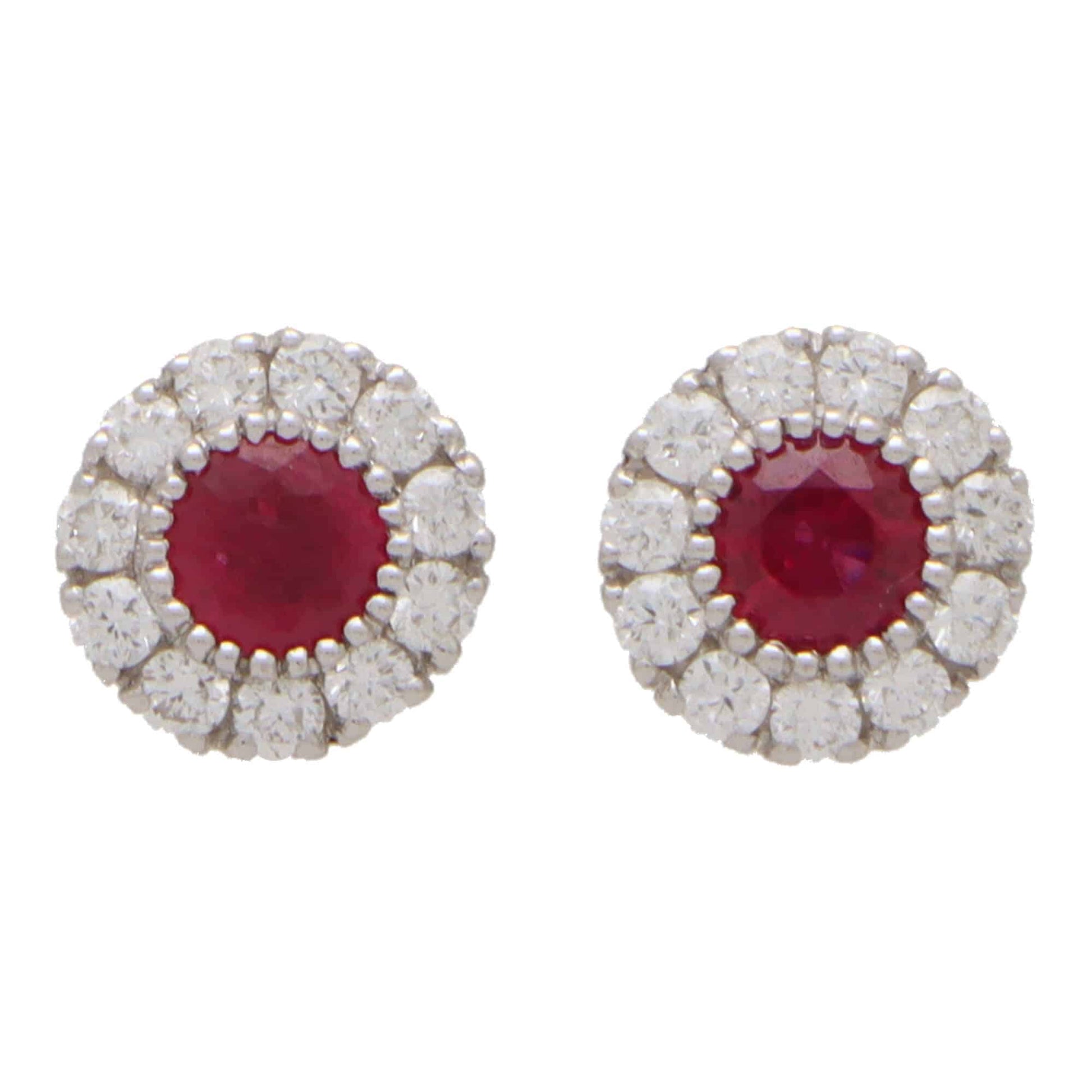 Ruby and diamond cluster earrings in white gold.