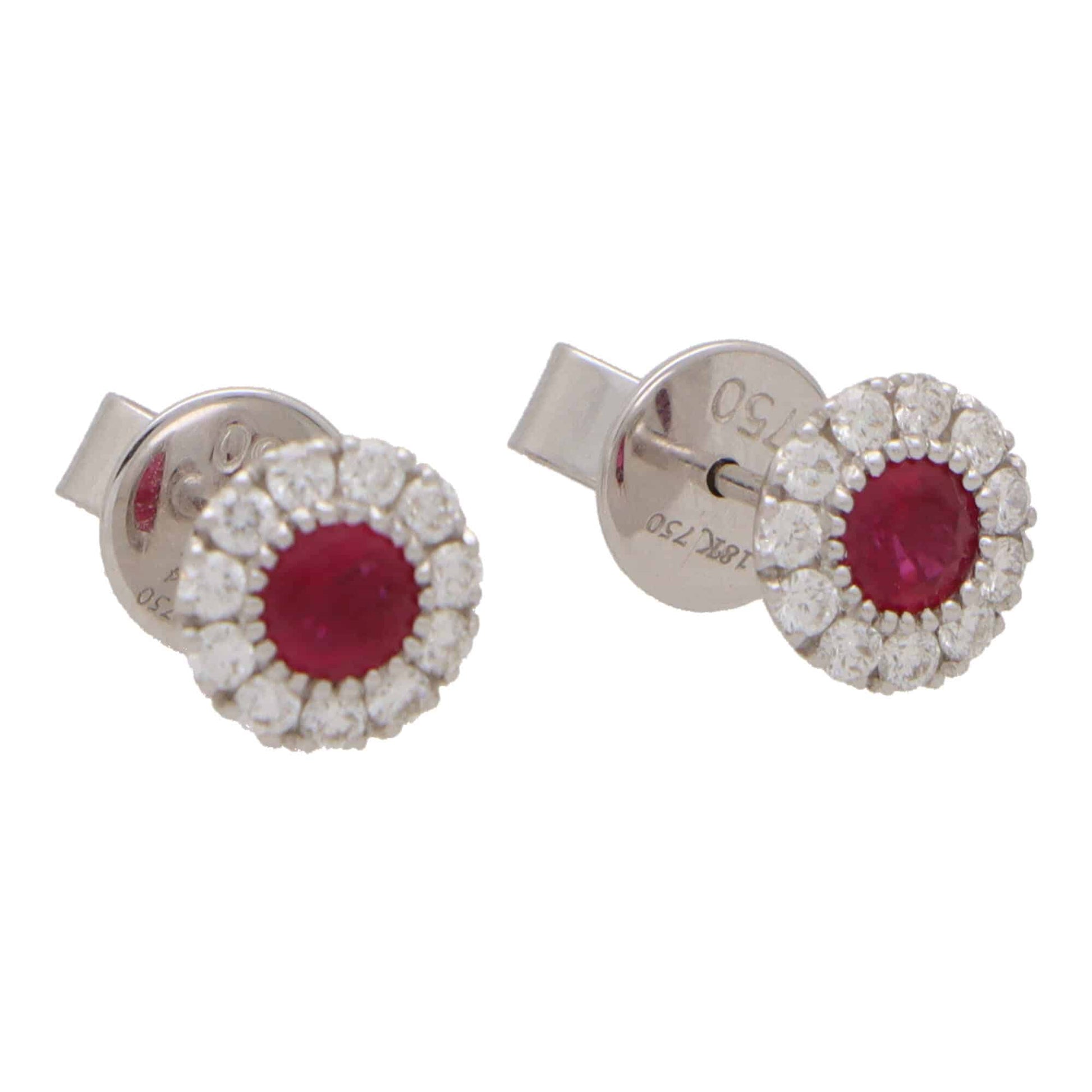 Ruby and diamond cluster earrings in white gold.