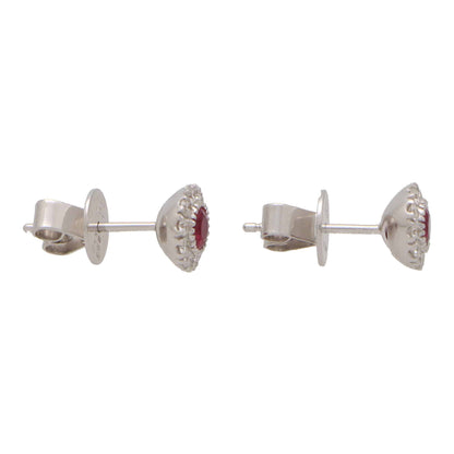 Ruby and diamond cluster earrings in white gold.