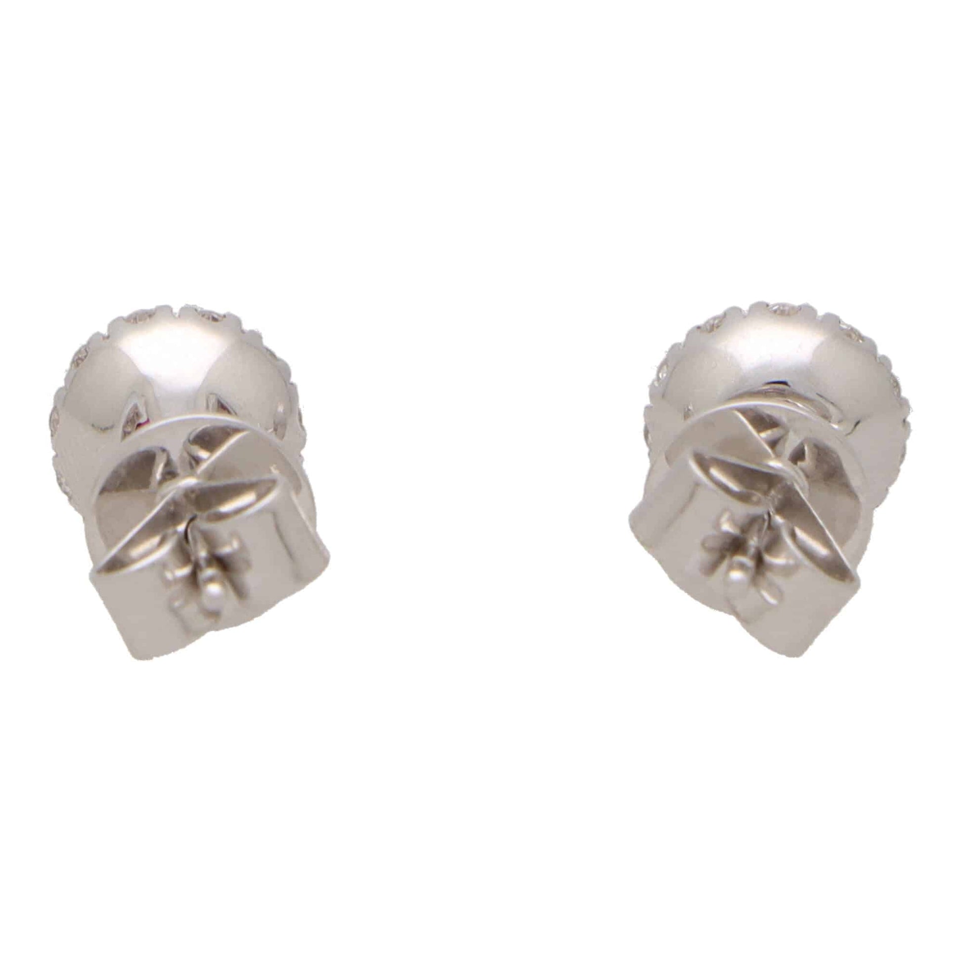 Ruby and diamond cluster earrings in white gold.