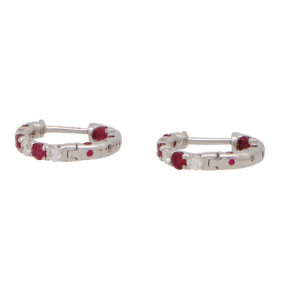 Ruby and diamond hoop earrings in white gold.