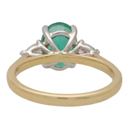 Emerald and Pear Cut Diamond Three Stone Engagement Ring