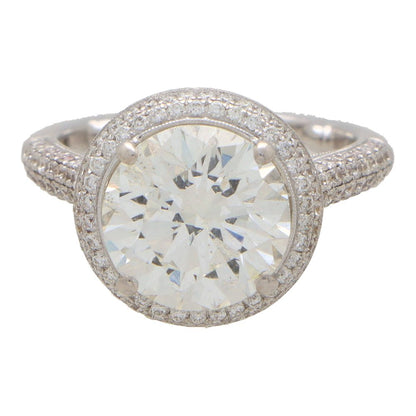 Diamond solitaire ring in platinum and yellow gold.