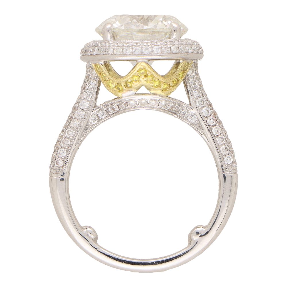 Diamond solitaire ring in platinum and yellow gold.