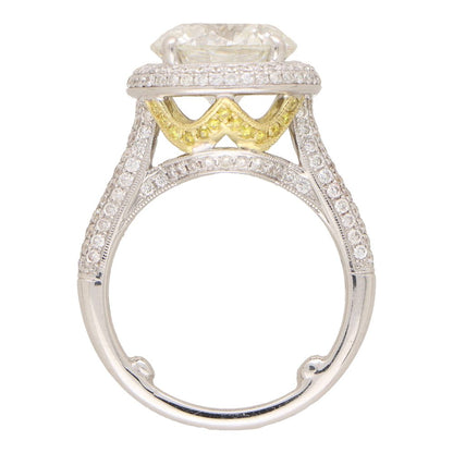 Diamond solitaire ring in platinum and yellow gold.
