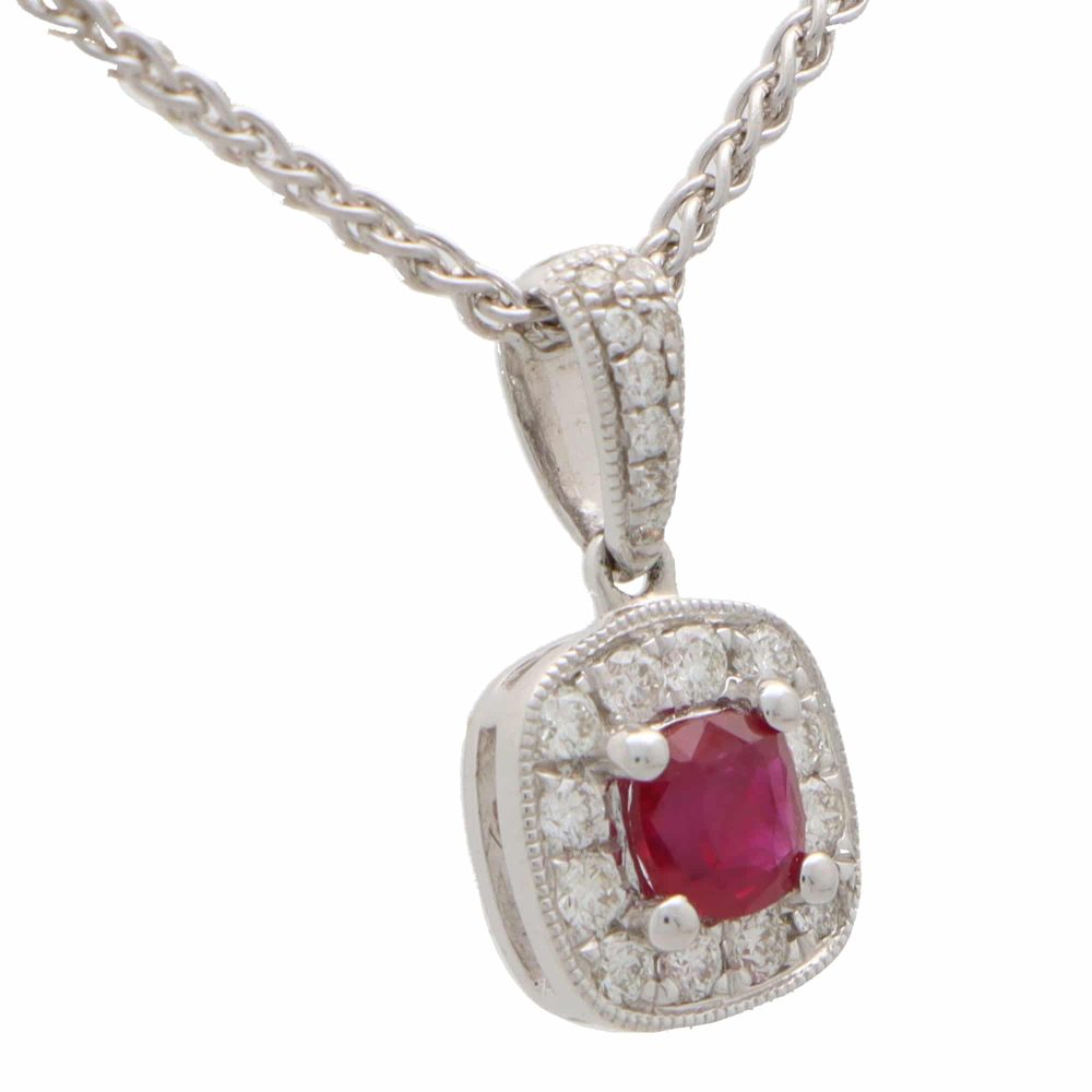 Ruby and diamond cluster pendant set in 18 carat white gold.