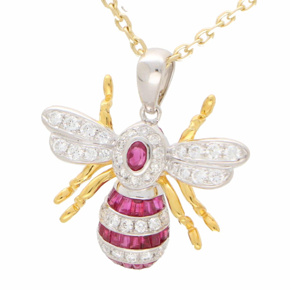 A modern ruby and diamond 18ct yellow and white gold bee pendant