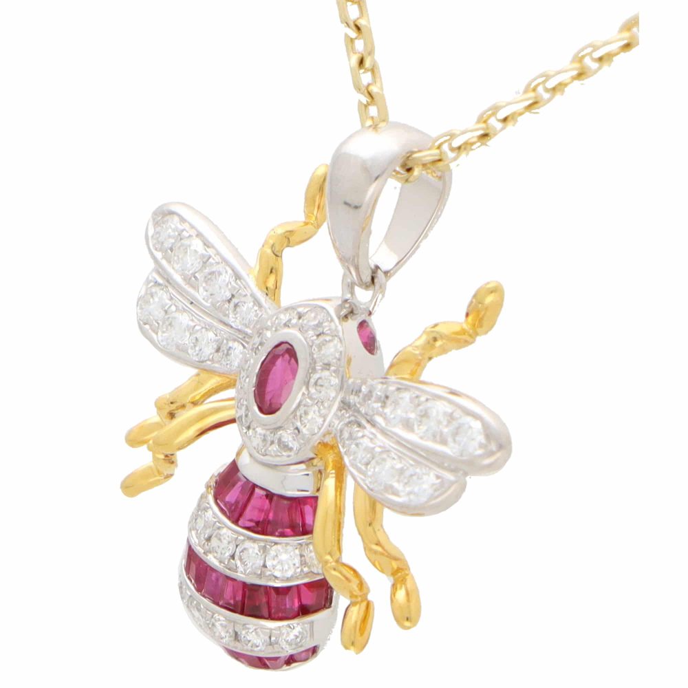A modern ruby and diamond 18ct yellow and white gold bee pendant