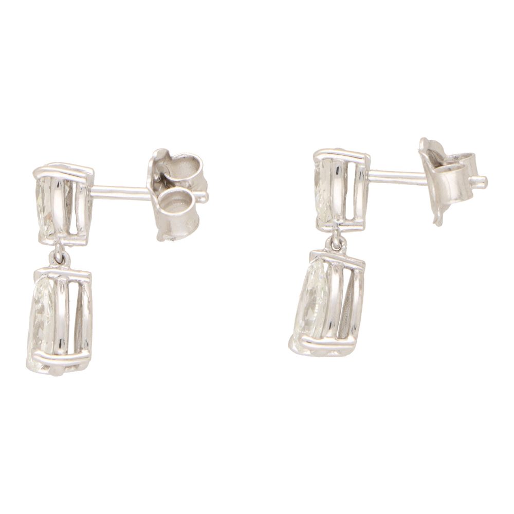 Diamond drop earrings set in platinum.