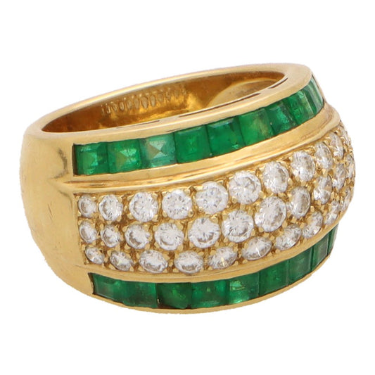 Vintage emerald and diamond bombe ring in yellow gold.