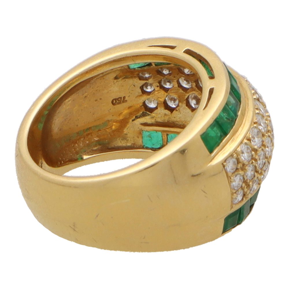 Vintage emerald and diamond bombe ring in yellow gold.