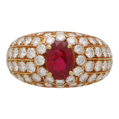 Vintage ruby and diamond cluster bombe ring in yellow gold.