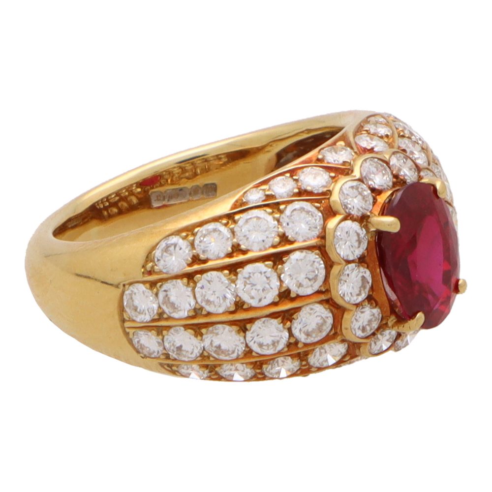 Vintage ruby and diamond cluster bombe ring in yellow gold.
