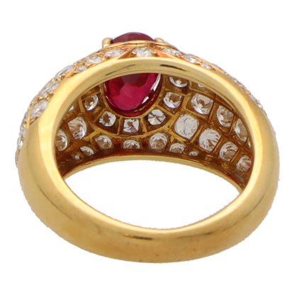 Vintage ruby and diamond cluster bombe ring in yellow gold.