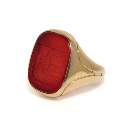 A yellow gold carnelian set signet ring with an intaglio