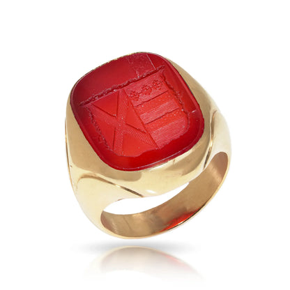 A yellow gold carnelian set signet ring with an intaglio