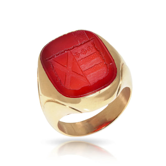 A yellow gold carnelian set signet ring with an intaglio