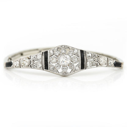 Art Deco 2ct Old Mine Cut Diamond and Onyx Bracelet, central 1ct G colour oval old mine cut diamond with a further 1ct diamond and calibre onyx in 18ct white gold