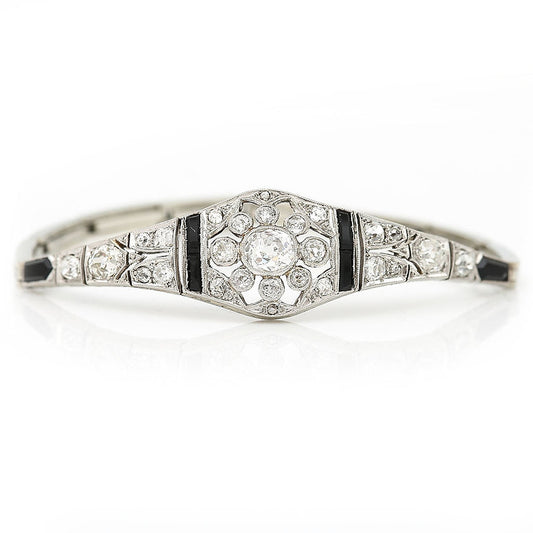 Art Deco 2ct Old Mine Cut Diamond and Onyx Bracelet, central 1ct G colour oval old mine cut diamond with a further 1ct diamond and calibre onyx in 18ct white gold