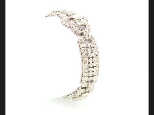 A Luxurious Art Deco diamond bracelet, a statement piece exhibiting the decadence of the era, circa 1930. Est. diamond weight totaling 12ct, Set in Platinum