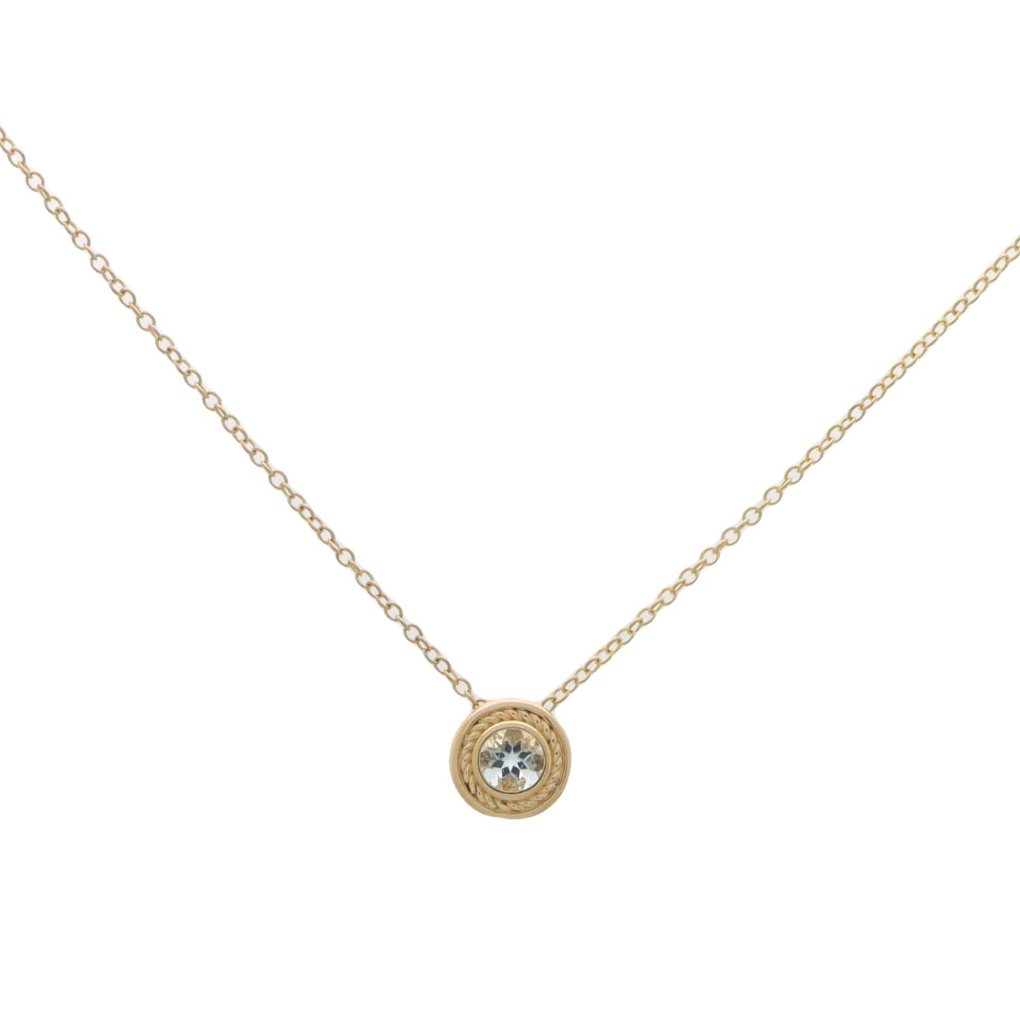 A yellow gold pendant necklace with a round aquamarine, on a white background