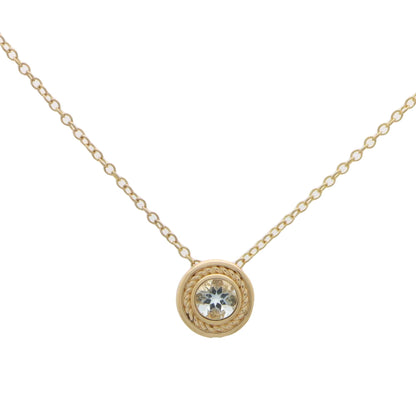 A yellow gold pendant necklace with a round aquamarine, on a white background