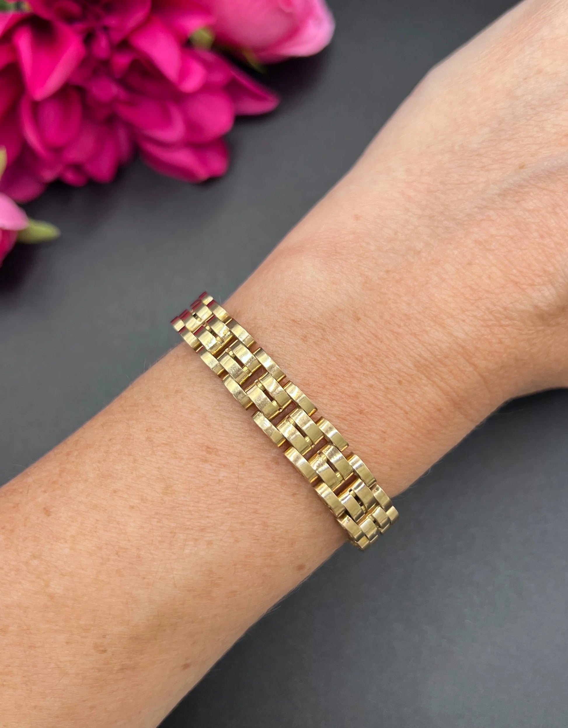 A yellow gold link bracelet, modelled on a wrist