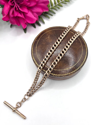 A rose gold curb link Albert chain with t-bar