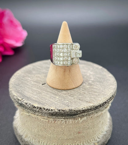 A round diamond tank style cocktail ring in platinum, on a ring cone