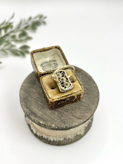 Art Deco 18 Carat Gold Rectangular Onyx and Diamond Three Stone Ring, Circa 1920