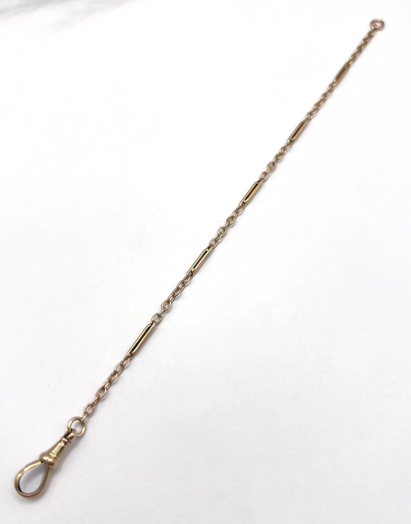 A yellow gold link bracelet with a lobster claw clasp