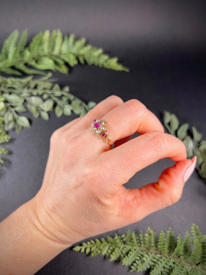 A yellow gold ruby and pearl floral cluster ring, modelled on a hand
